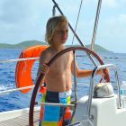 Intro To Sailing - Boy At The Helm