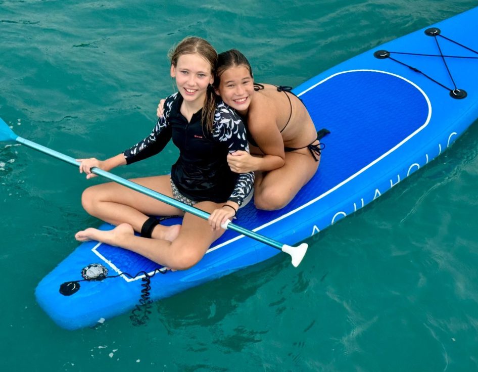 2 Girls on an AQUAHOLIC Stand Up Paddle Board