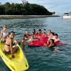 Group on Kayak & Watermat Enjoying The Sun & Sea